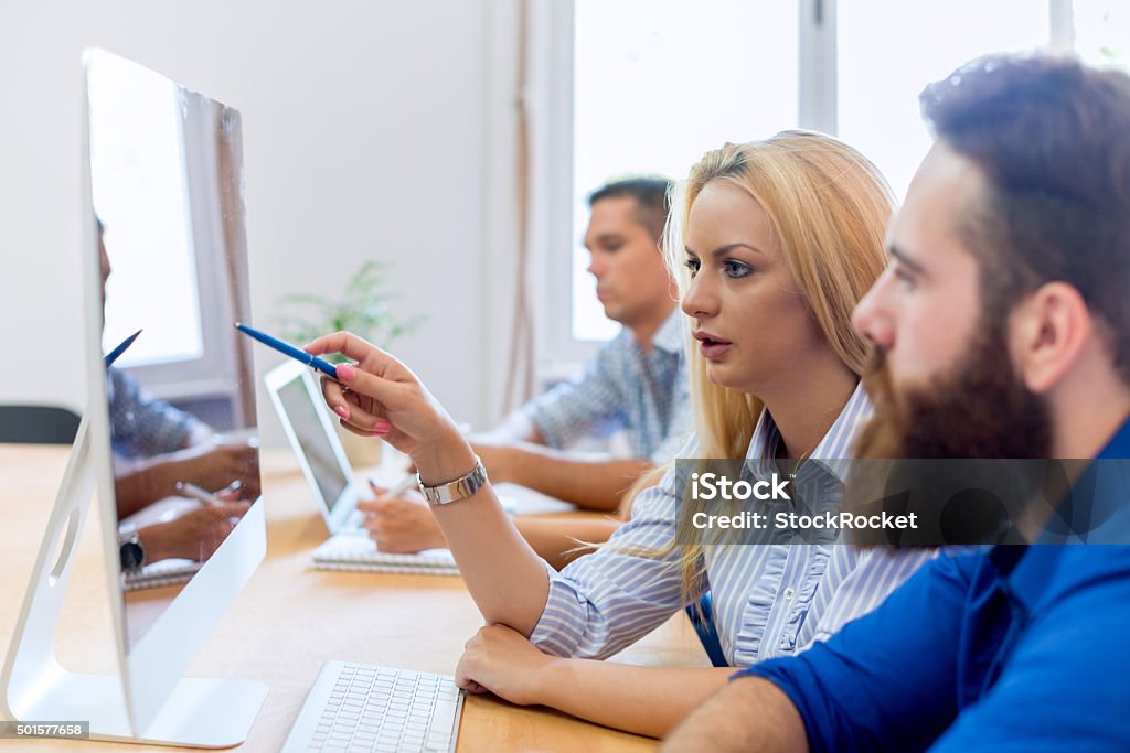 Start-up Team Team of young casual dressed people working in office. Advice Stock Photo