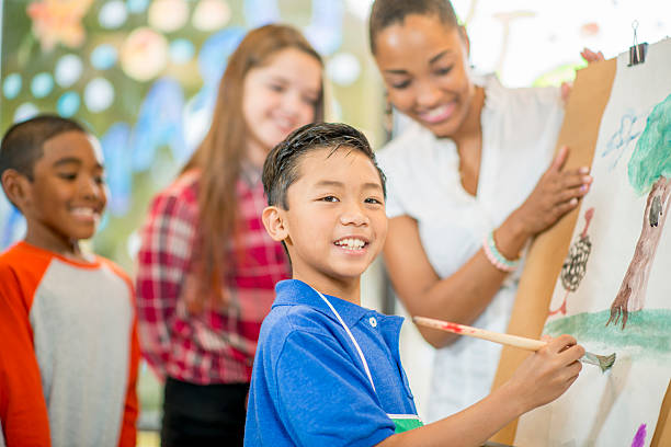 istock Proud Students Showing His Painting 501578032