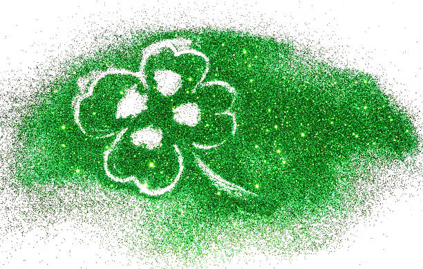 istock Abstract four-leaf clover of green glitter sparkle on white 501578354