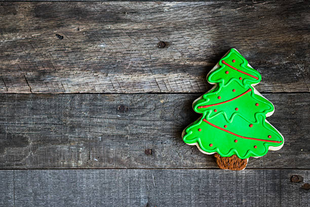 istock Christmas tree cookie on wooden background 501578992