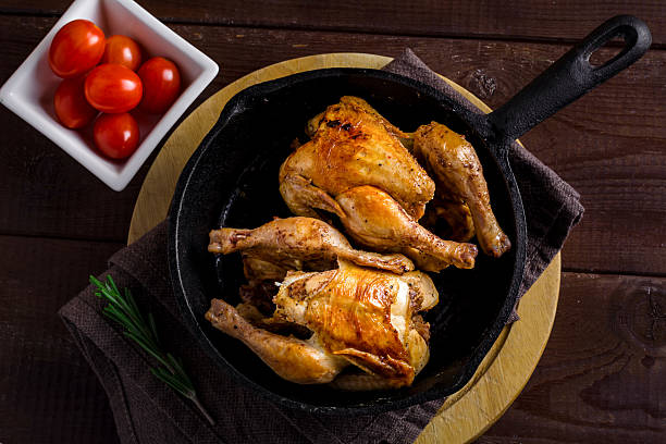 istock Roasted chickens in iron skillet 501580946