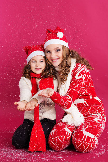 istock Two sisters are wearing winter clothes in studio 501581050