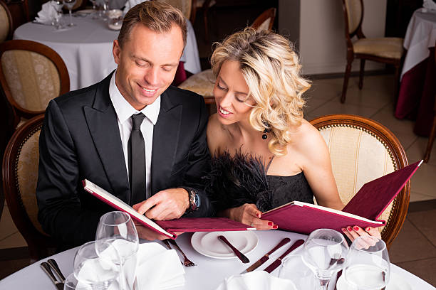 istock Man showing something in the menu to his lady 501581794