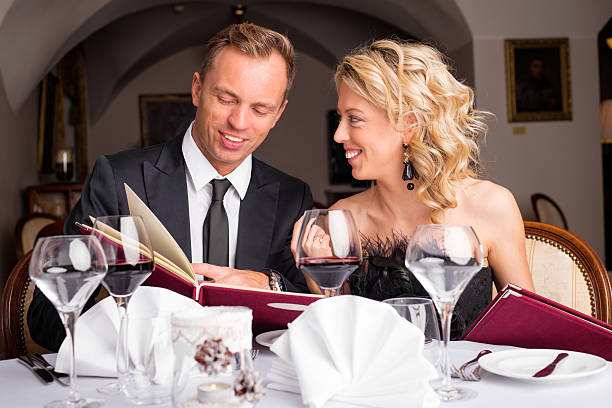 istock Couple at restaurant choosing what to eat from menu 501581934