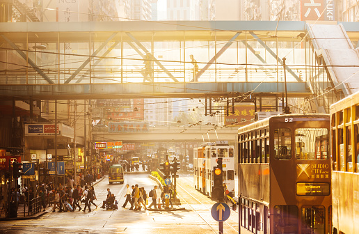 Street Scene of central Hong Kong with People and Famous double deckers