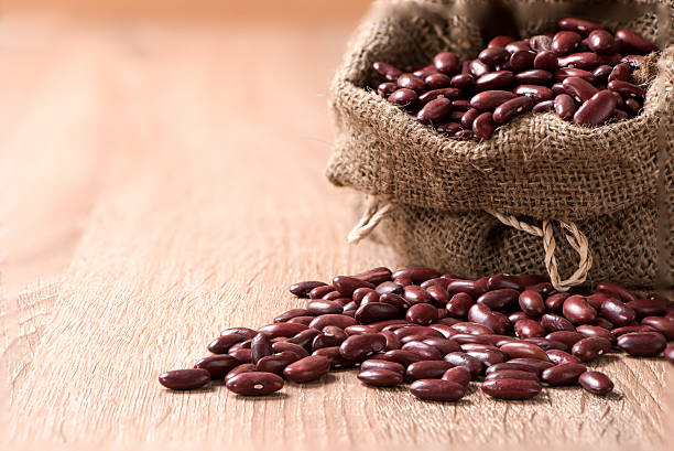 istock Kidney bean,Red beans in sack on wood table 501592744