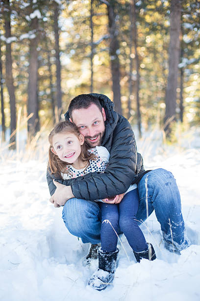 istock Young father with his daughter in the snow 501593106