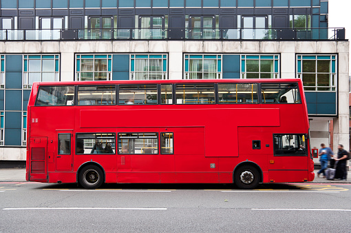 Double decker bus on street of London, red routemaster, horizontal orientation, England, UK.