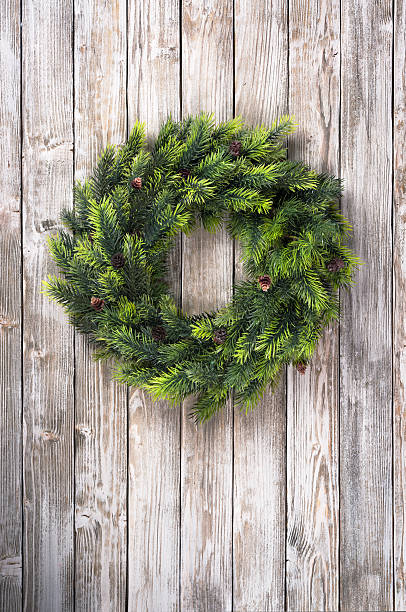 istock Christmas wreath on wooden door 501595540
