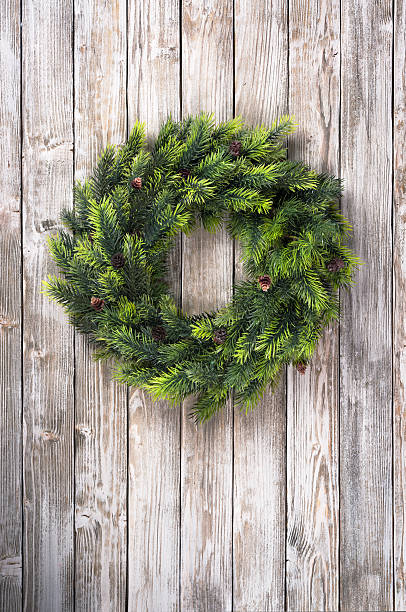 Christmas wreath on wooden door stock photo