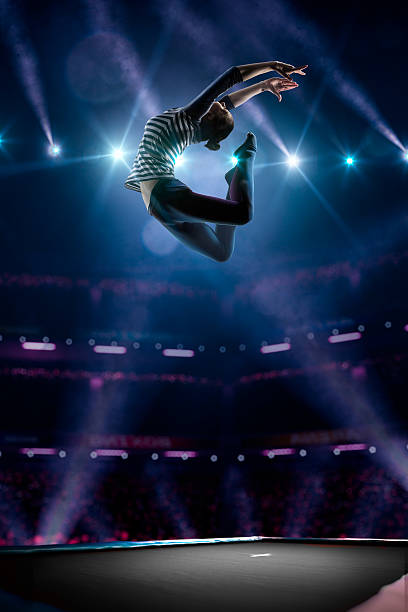 istock Young girl is jumping on trampoline 501596212