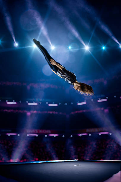 istock Young girl is jumping on trampoline 501596276