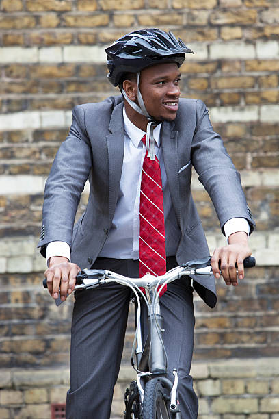 Portrait of African American businessman riding Bicycle