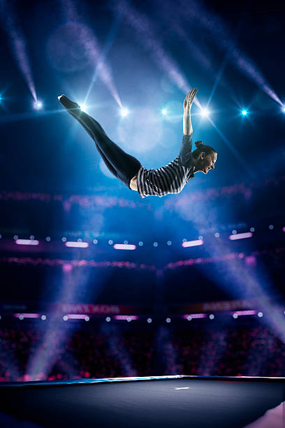 istock Young girl is jumping on trampoline 501596528