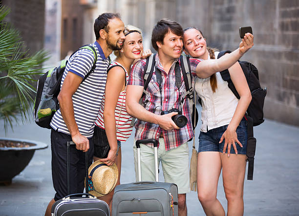 istock Group of tourists making selfie 501597082