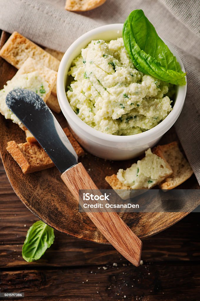 Cheese cream with parmesan and basil Cheese cream with parmesan and basil, selective focus 2015 Stock Photo