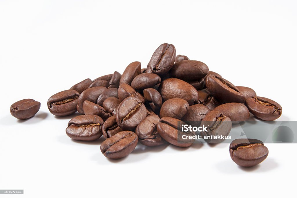 Coffee Beans Heap of coffee beans isolated on white. Roasted Coffee Bean Stock Photo