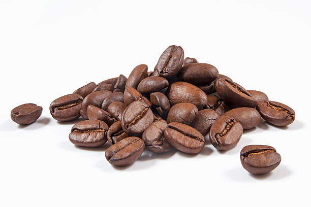 Coffee Beans Heap of coffee beans isolated on white. roasted coffee bean photos stock pictures, royalty-free photos & images
