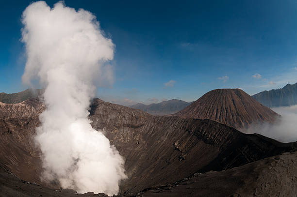 istock Volcano Bromo Errupting Smoke and sulphur under blue sky 501599590