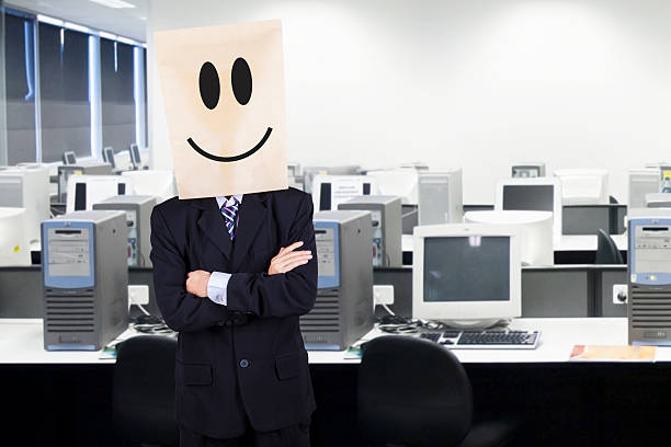 istock Businessman with cardboard head smiling 501600523