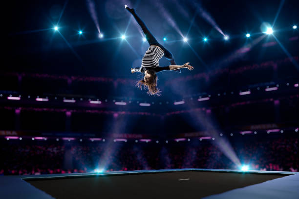 istock Young girl is jumping on trampoline 501601566