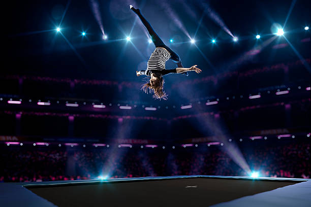 istock Young girl is jumping on trampoline 501601604