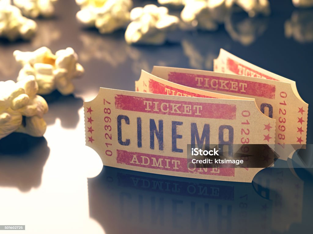 Cinema Vintage Entry ticket to the cinema with popcorn around. Clipping path included. Arts Culture and Entertainment Stock Photo