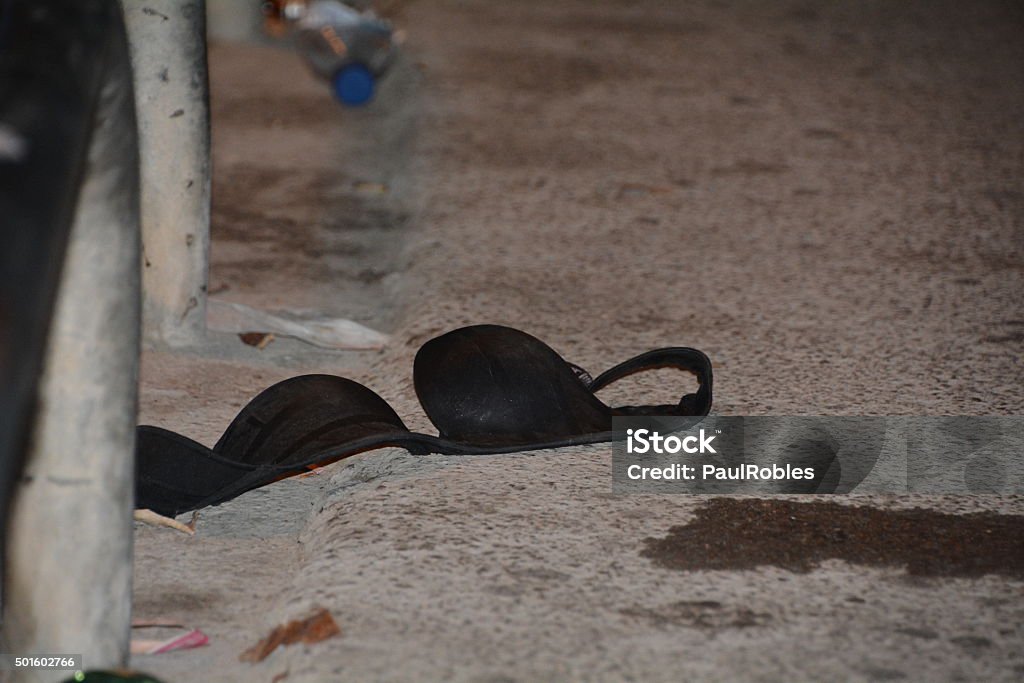 Discarded bra Bra on a dirty street Sexual Assault Stock Photo