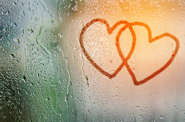 istock draw cople heart on natural water drops glass window background 501603008