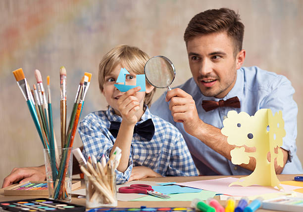istock Creative male babysitter with child 501603446