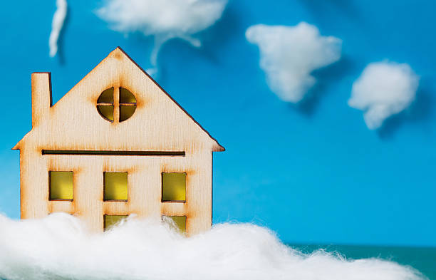 istock The house is on a blue background. Winter season. 501603936