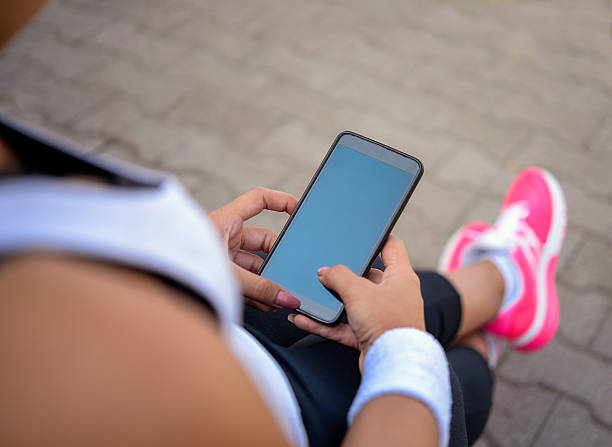 istock Female hand holding a phone 501605886