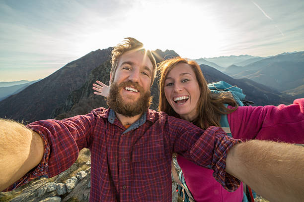 istock Two young adults hiking, take selfie portrait 501605944