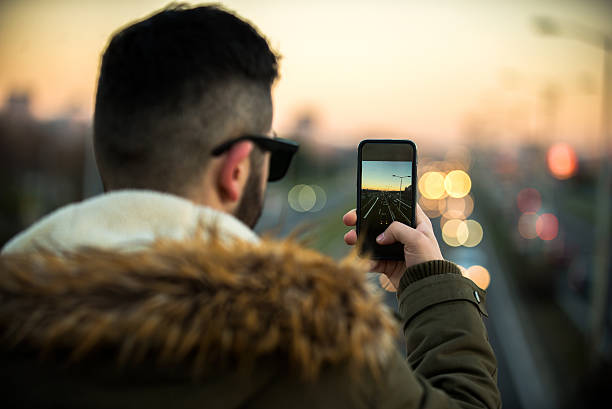 istock Man taking a photo on the bridge 501606088