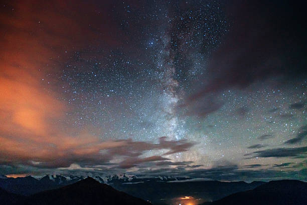 istock fantastic winter meteor shower and the snow-capped mountains 501606860