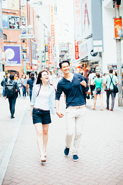 istock Young couple against cityscape background 501607320