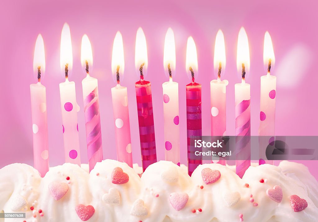 Pink birthday candles Pink birthday candles and balloons Birthday Stock Photo