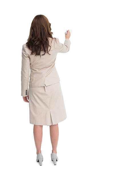 istock Businesswoman standing back to camera writing with marker 501613305