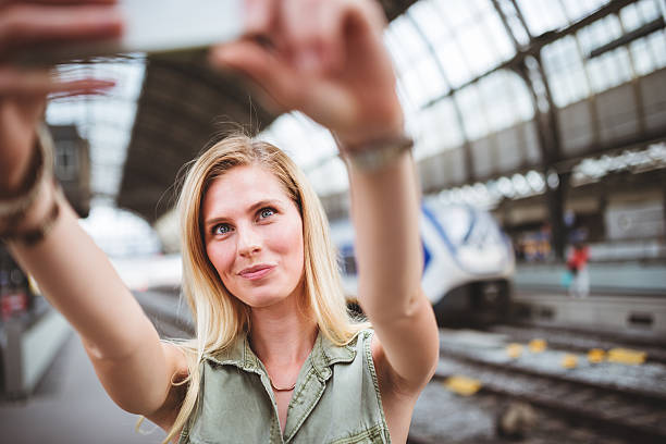 istock smiling tourist on the station 501615251