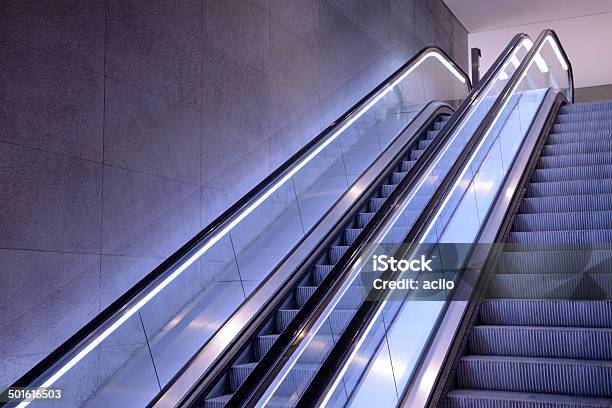 Two Escalators Stock Photo - Download Image Now - Architectural Feature, Blue, Diminishing Perspective