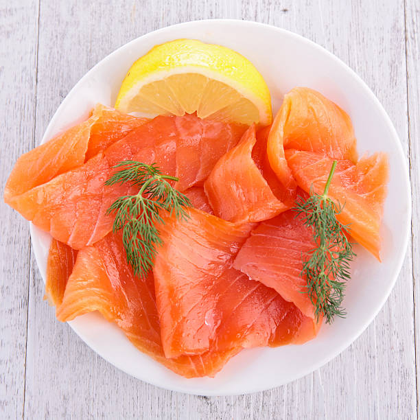 salmon on plate salmon on plate smoked salmon stock pictures, royalty-free photos & images