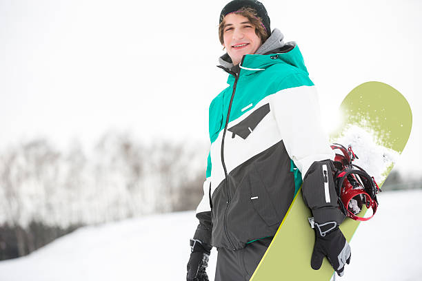 istock Young Adults Skiing and Snowboarding snow play in Winter 501618215