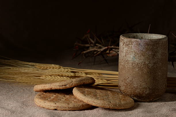 istock Cup and bread with crown of thorns 501618252