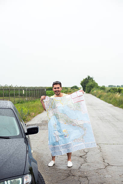 istock Young man parked his car by the side of a 501618504