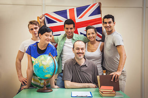 istock Smiling students in classroom with the teacher 501618847