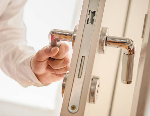 Hand opens the door Hand opens the door doorknob stock pictures, royalty-free photos & images