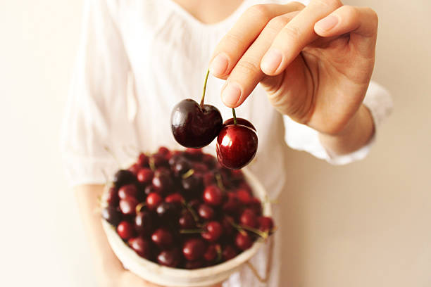 istock Hands full of cherries 501621450