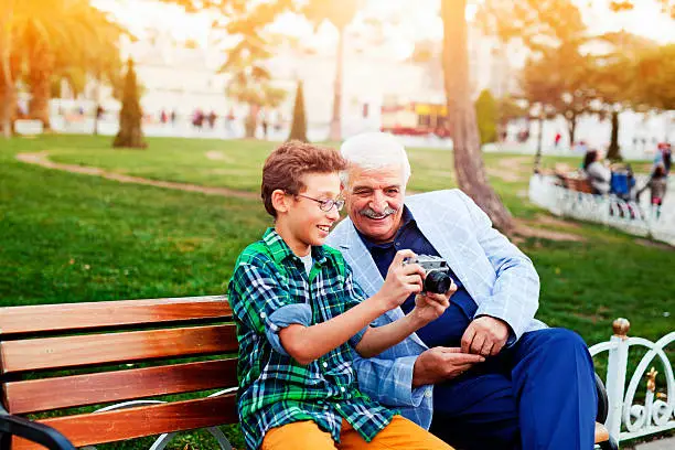 Photo of Grandfather and grandson with camera in Istanbul.