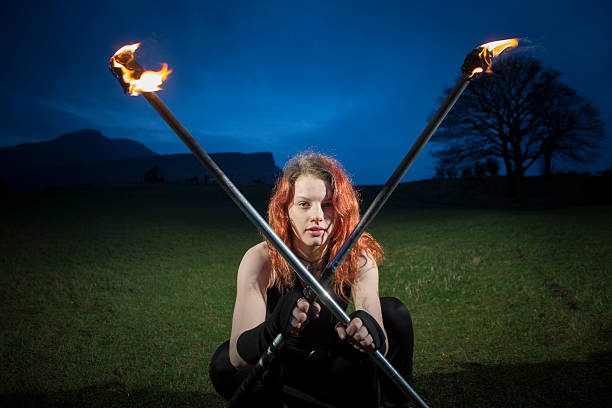 istock Dancer With Flaming Staffs 501621750