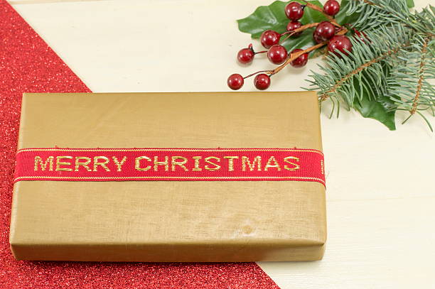 istock Merry Christmas card with Christmas present and a mistletoe 501622570